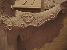Closeup of a plaster cast of a Roman sculpture of the goddess Athena wearing the scaly aegis