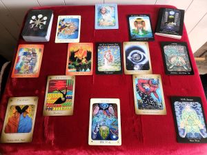  Tarot cards spread out on a black cloth